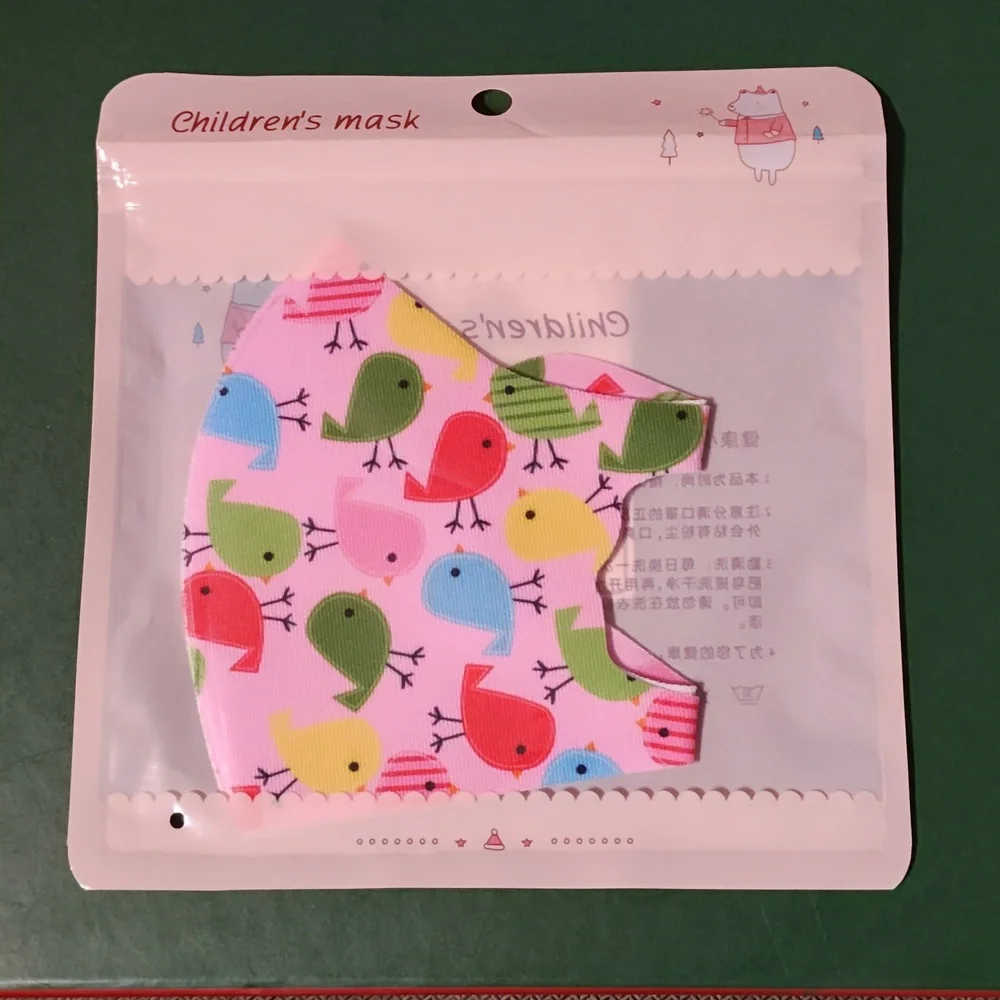 Children's re Usable face mask new in package never opened